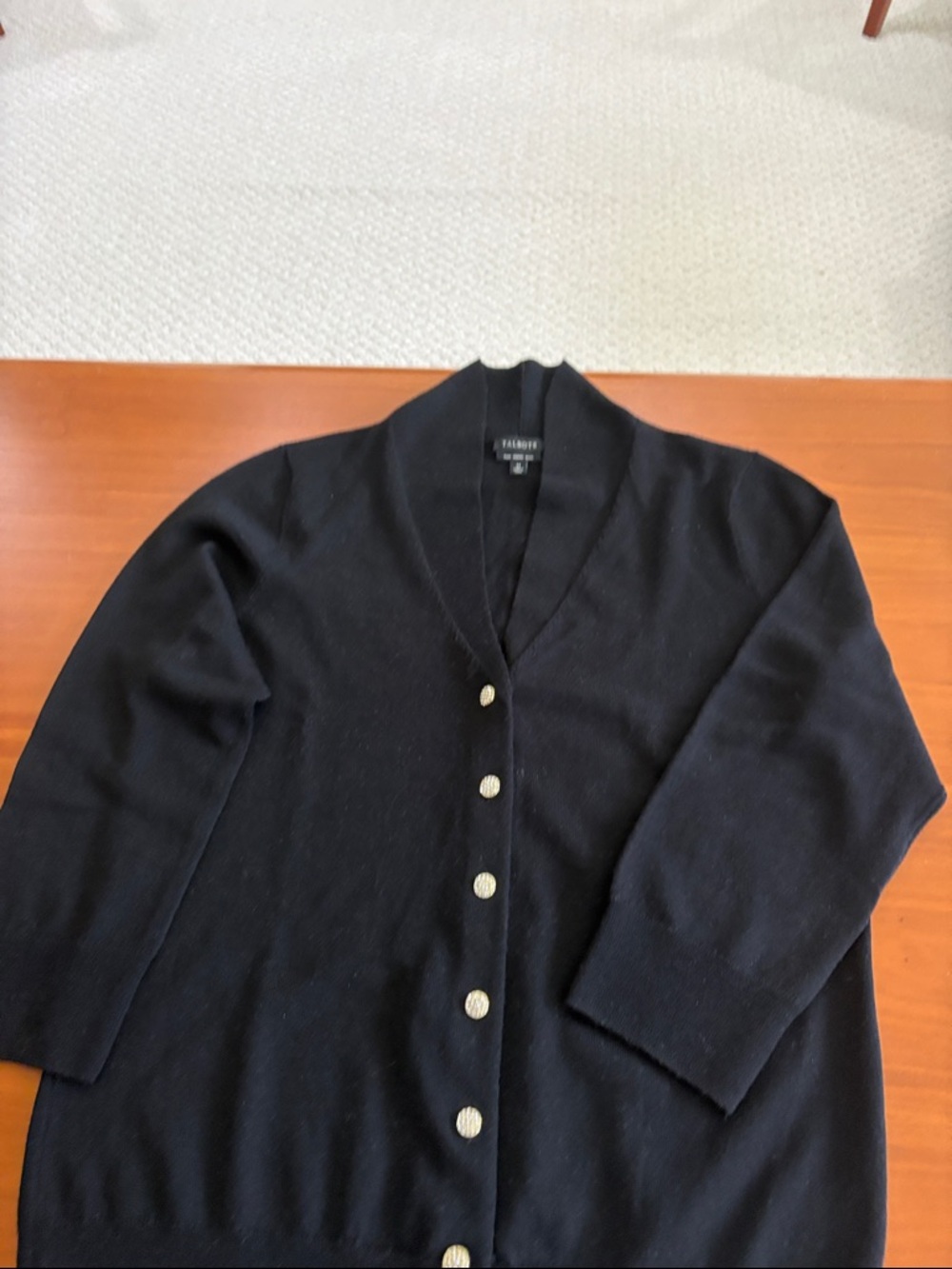 100% Marino wool very comfortable soft  cardigan. Fancy stone studded buttons.